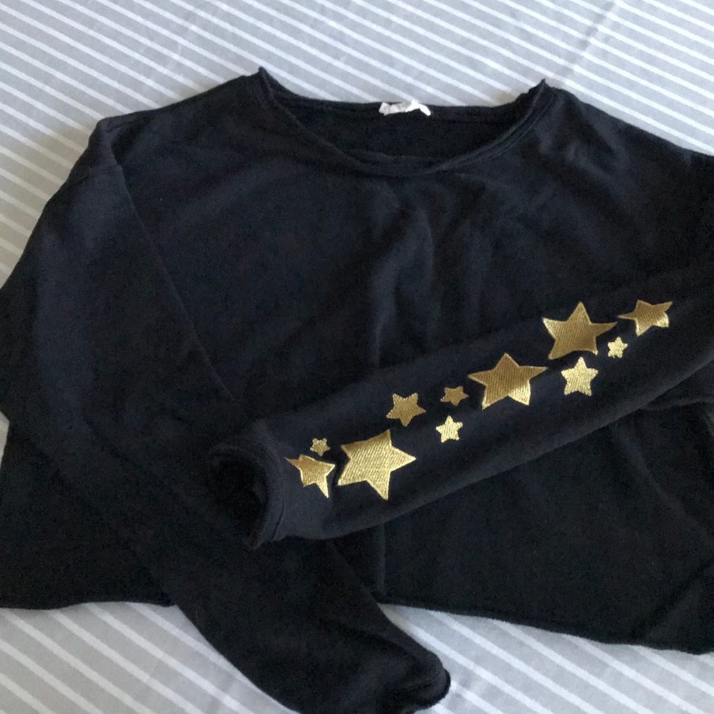 Black crop sweatshirt with gold star sleeve
